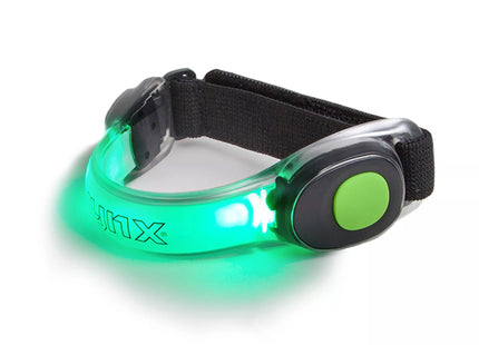 a green light up dog collar on a white background