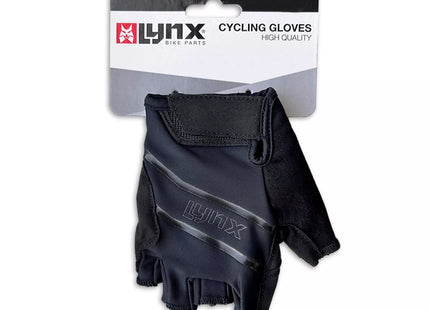 a pair of black gloves sitting on top of a package